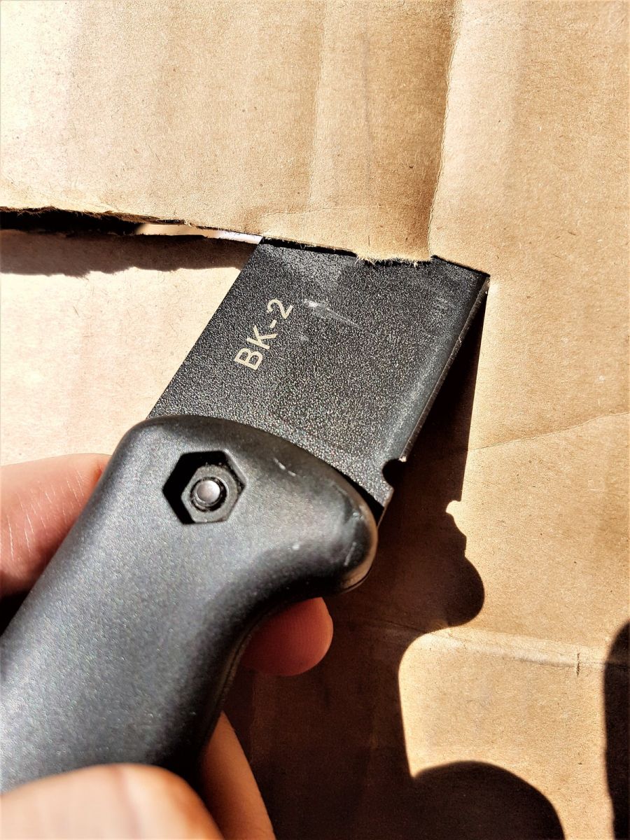 Ka-Bar Companion Slicing through cardboard